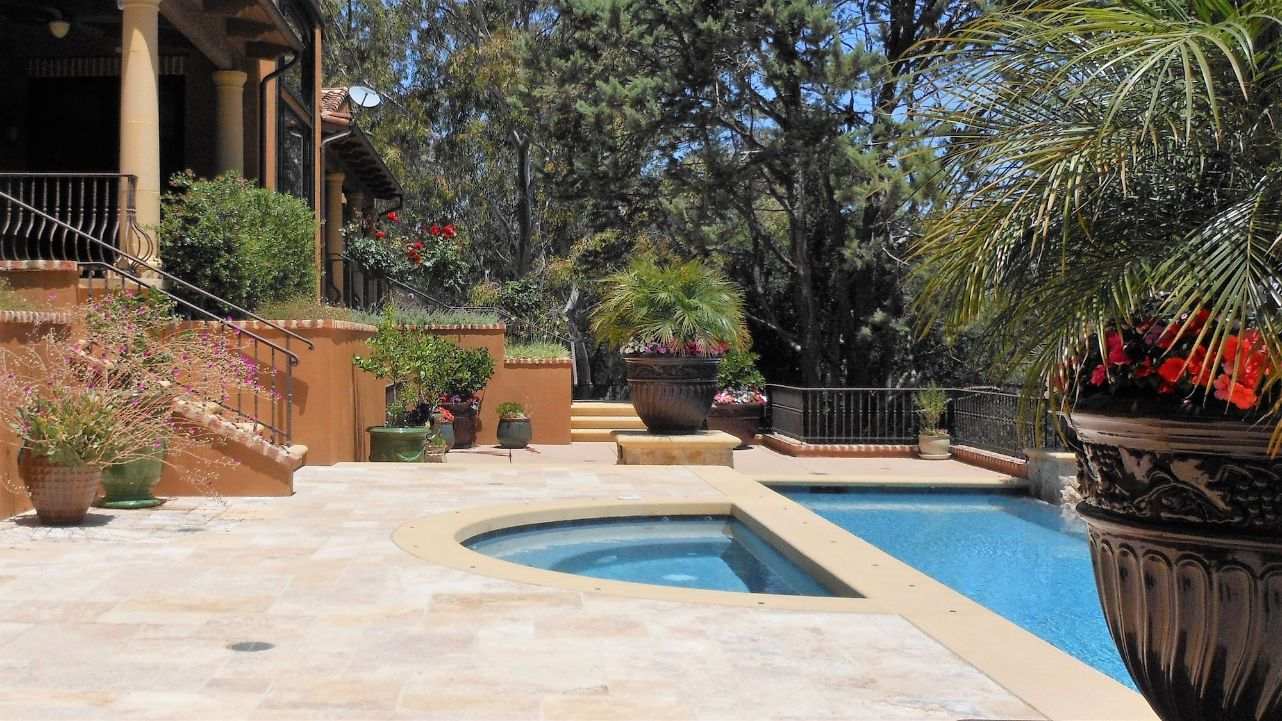 saratoga stone manor spa pool and pots in a unique backyard design build project